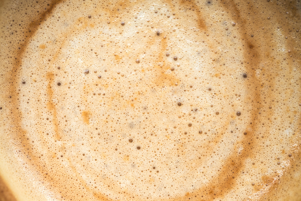 Close-up of hot coffee in a white mug